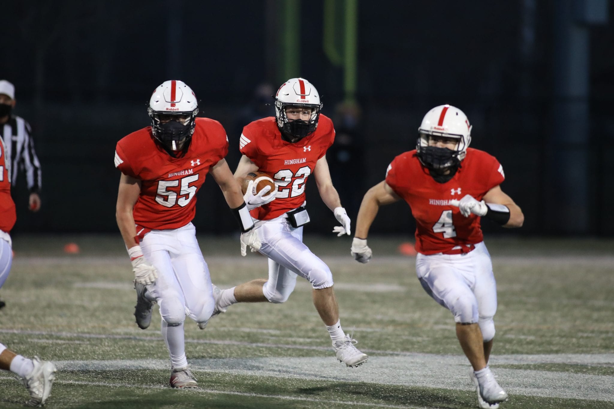 Senior Cooper Estes follows his blockers late in the game as Hingham tried to mount a comeback.  