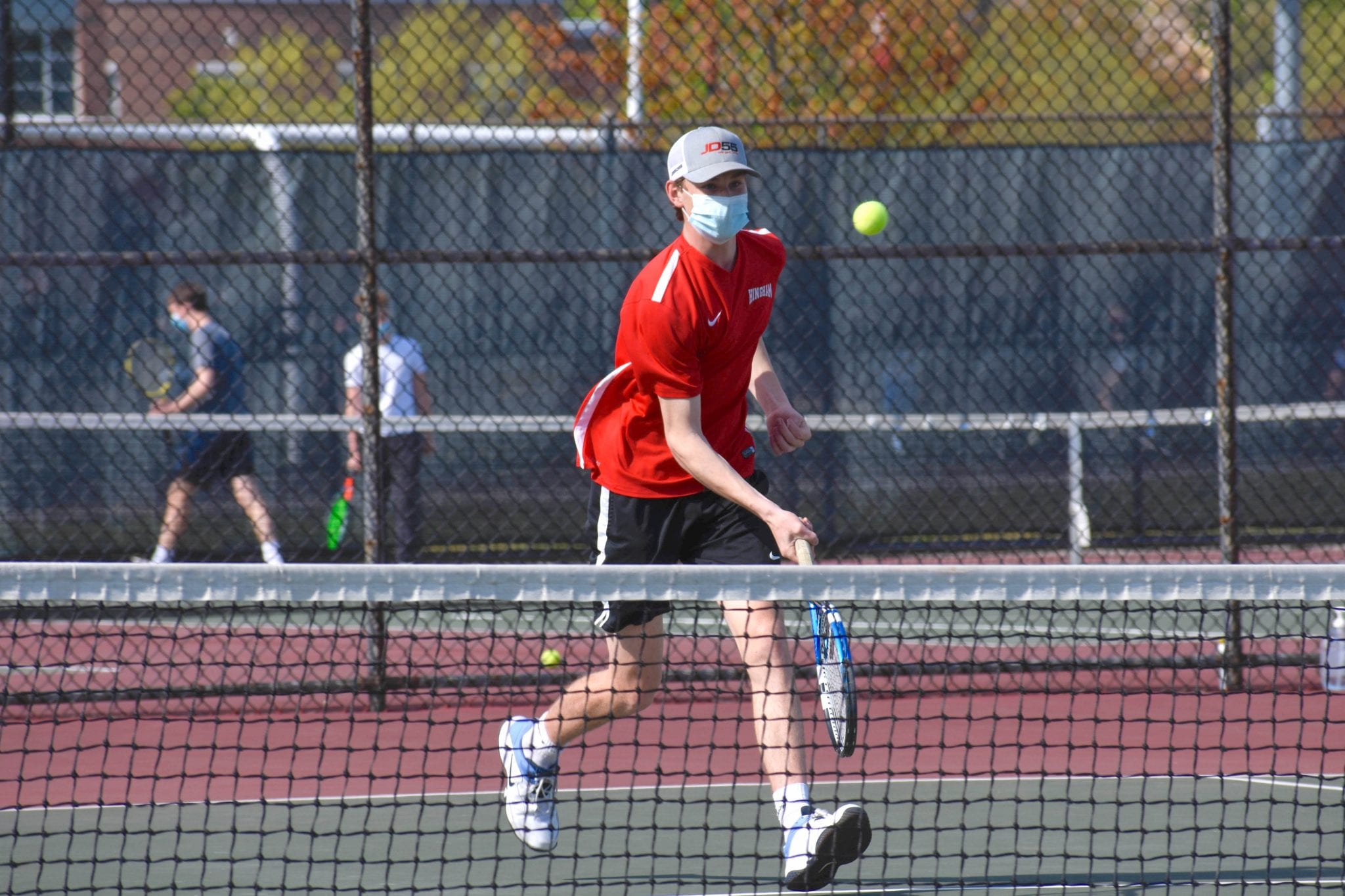 Sophomore Charlie Even meets a volley at the net. (Photo credit: Jake Bednarski)