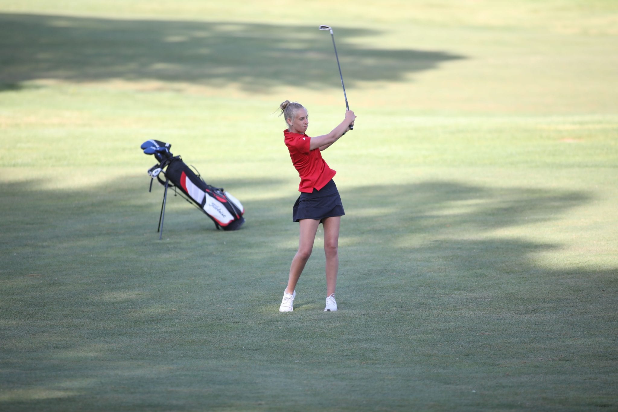 Senior captain Lily Hornstra with an approach shot on the third hole. 