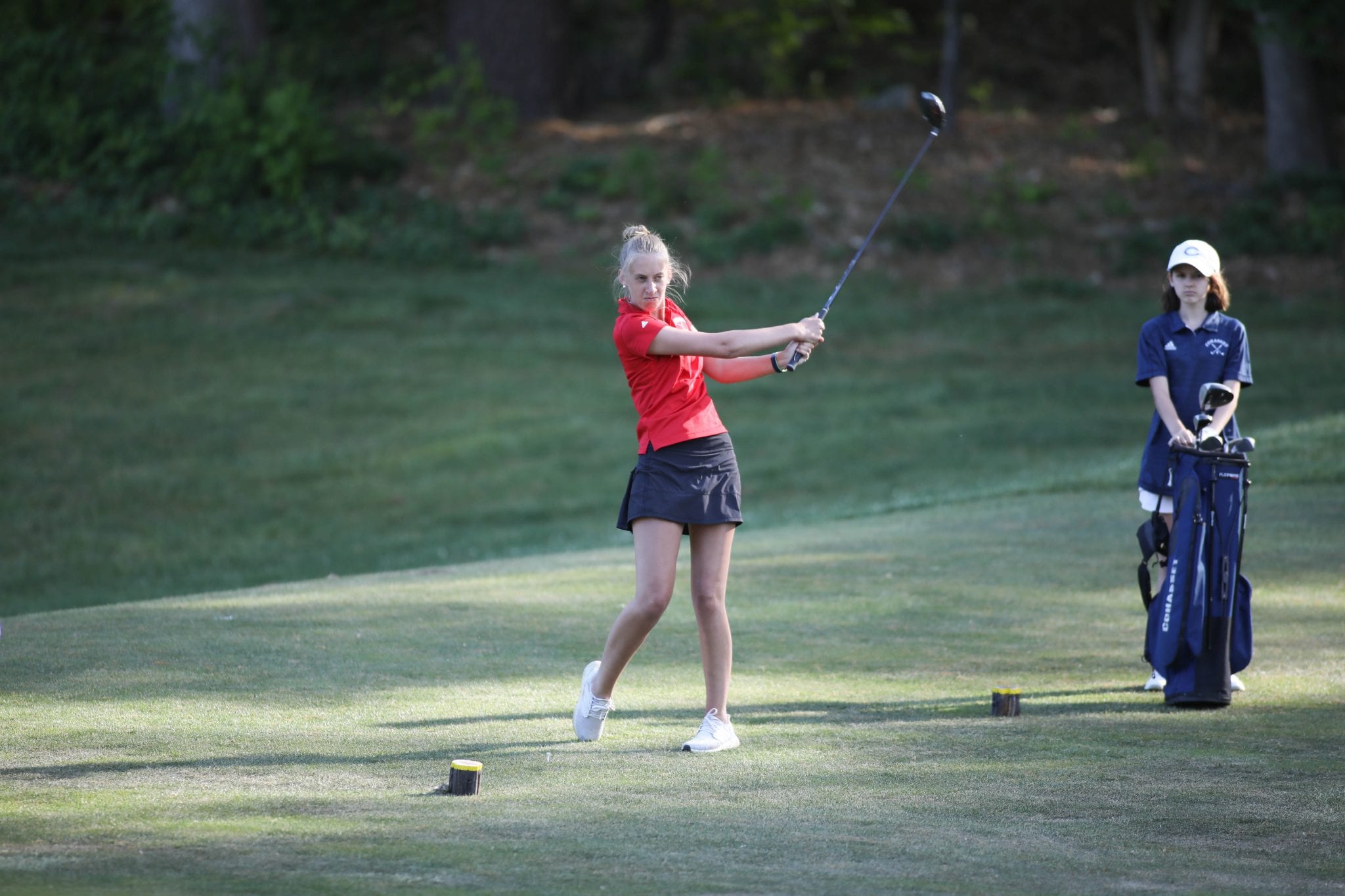 Senior captain Lily Hornstra with a drive on the fourth hole. 