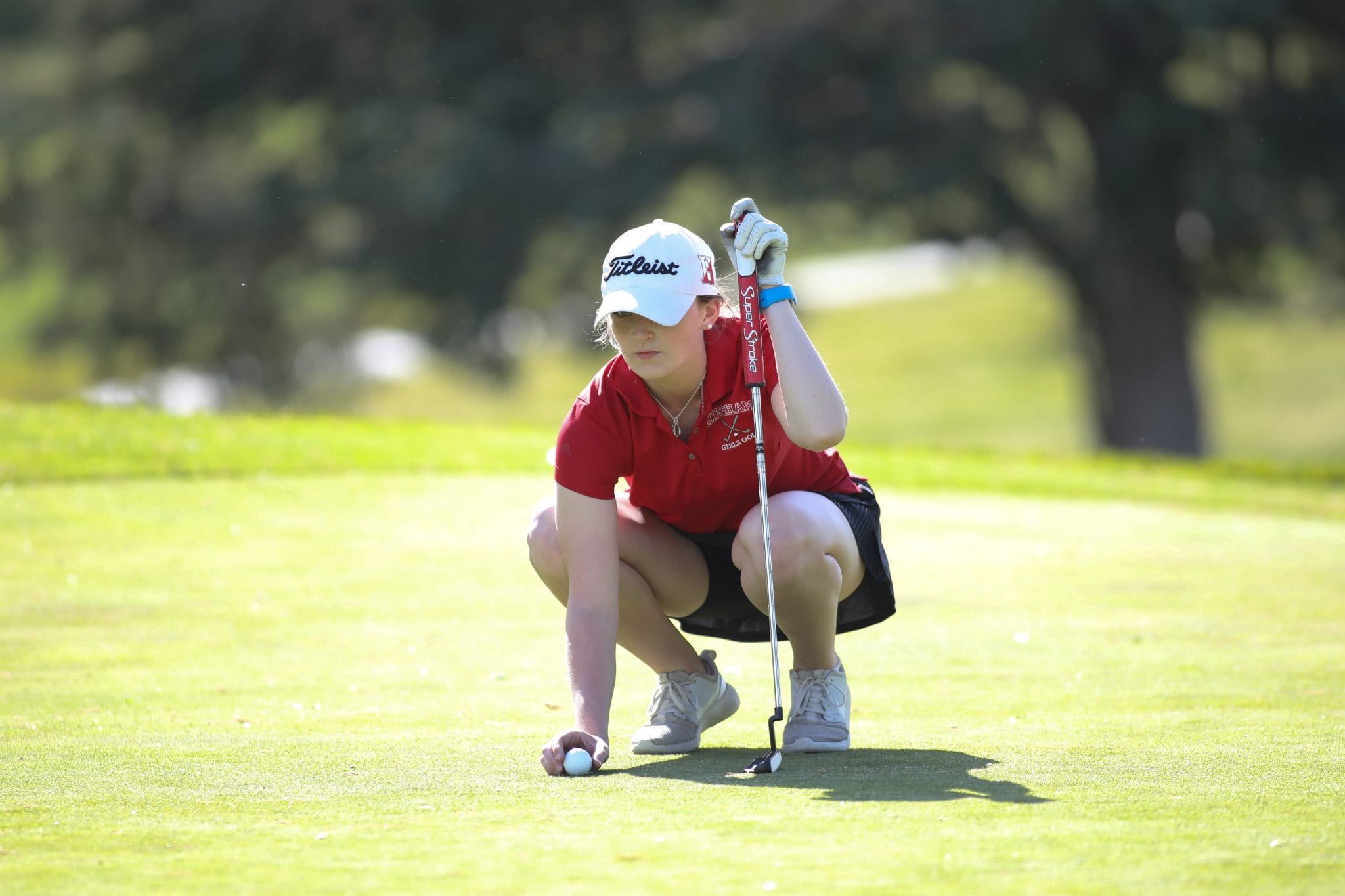 Junior Niamh McGuinness lines up her putt on the first green.