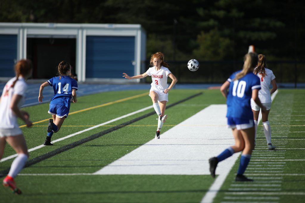 Senior Cara Chiappinelli kicks attempts to find her teammate down the field late in the game. 