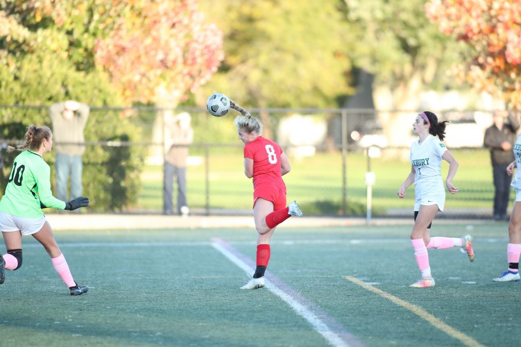 Junior Sophie Reale attempts to head one in early in the second half. 