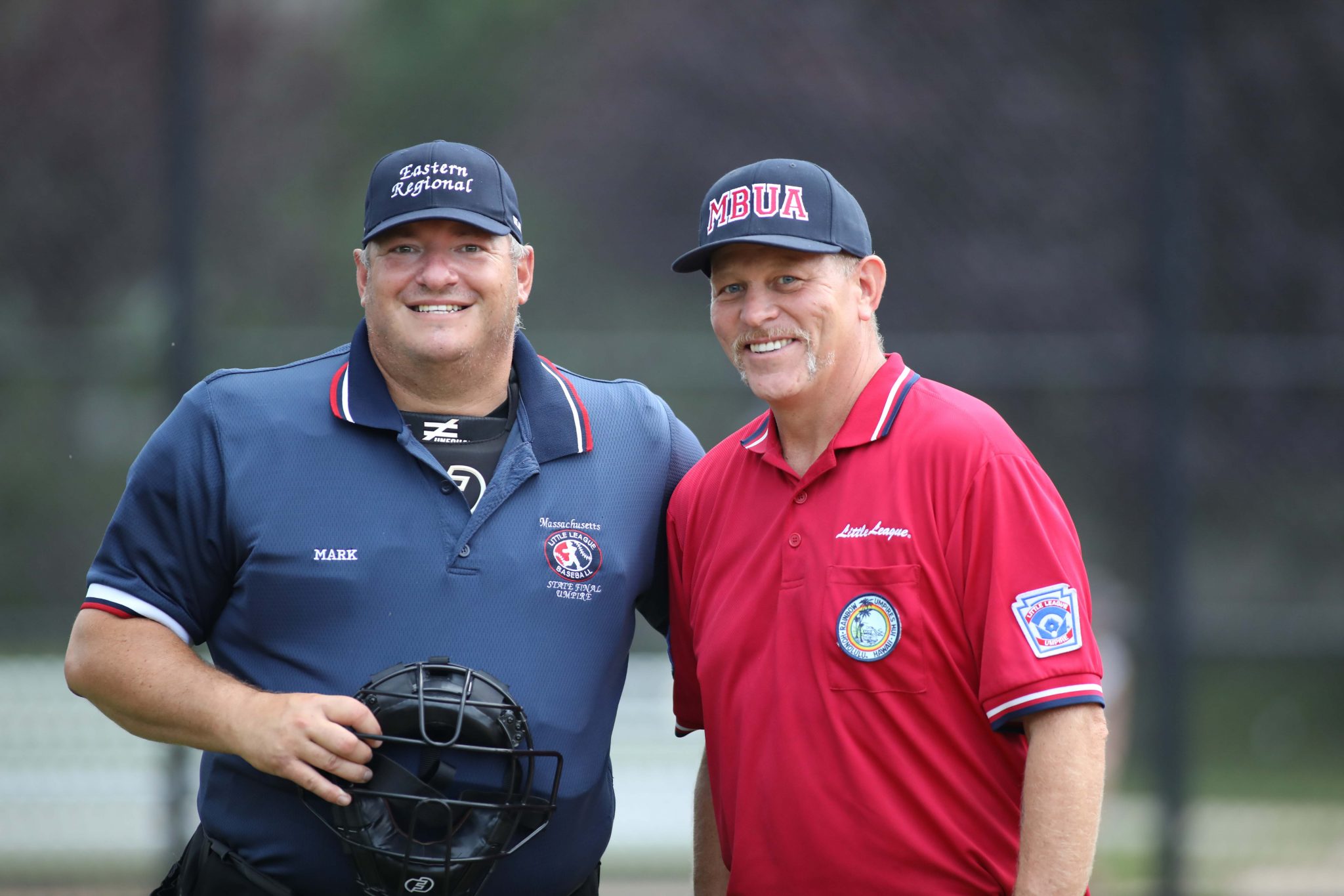 Mark Rulli, left, with fellow south shore umpire Dave Martin this summer before a local Little League World Series qualifying game.  