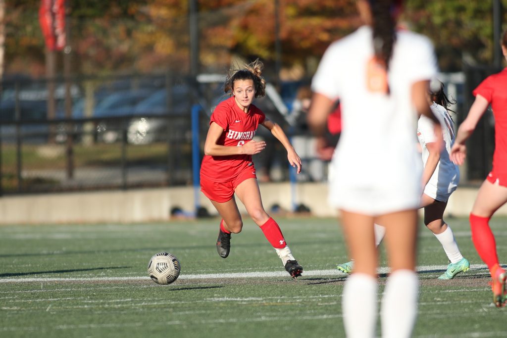 Junior Maddie Aughe dribbles up past midfield in the second half. 