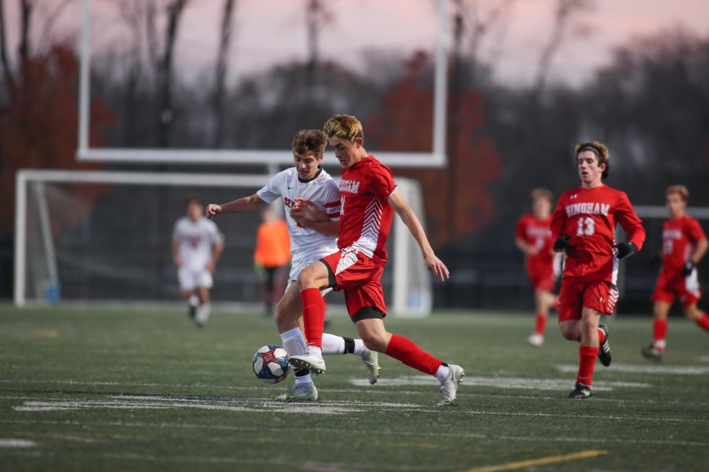 Junior Cole Sampson out races the Central Catholic defender.