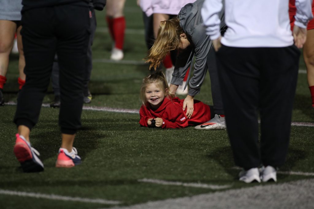 Hingham's biggest fan celebrating on the field after the win. 