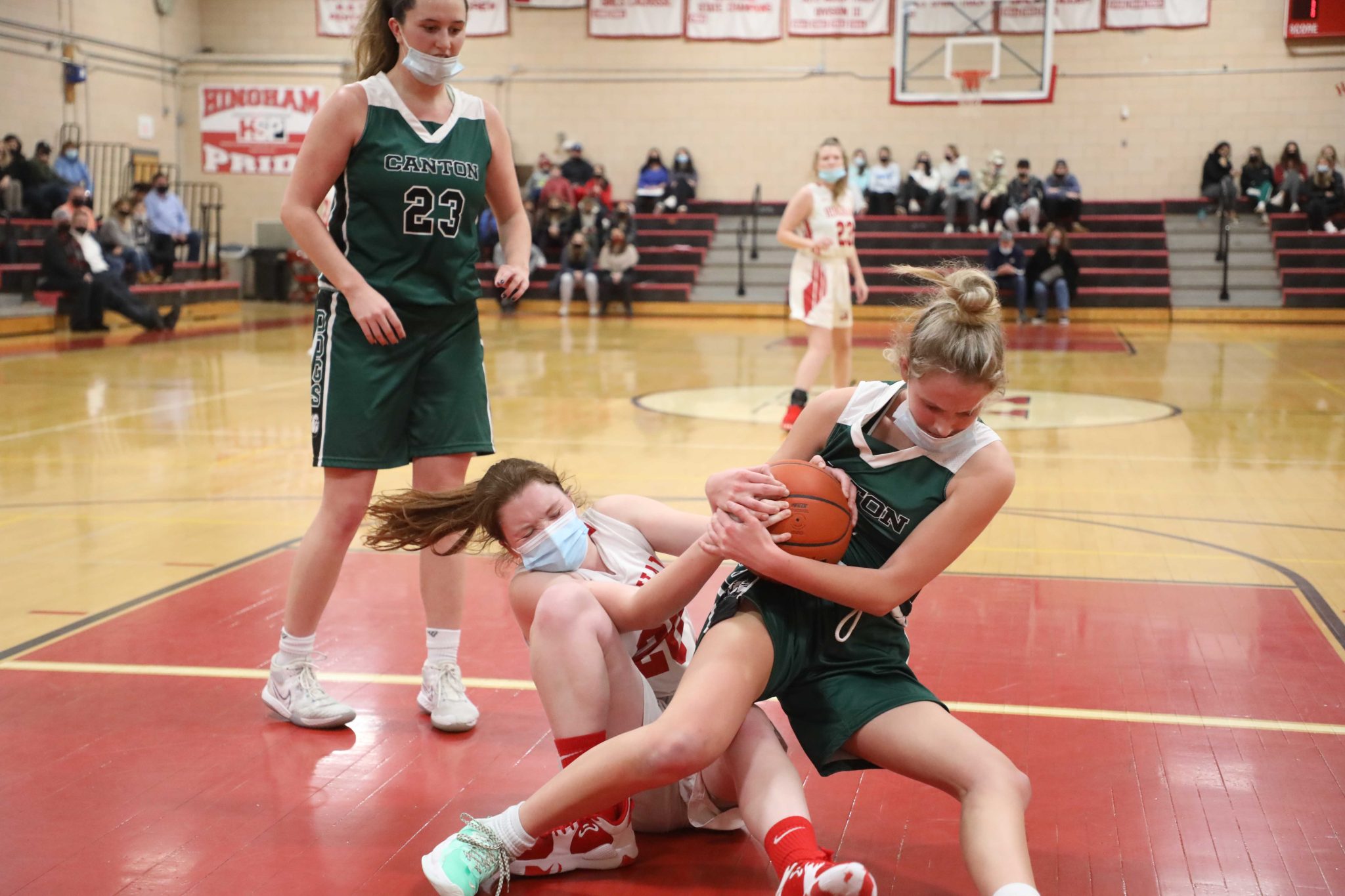 Senior Madison Aylward battles for a loose ball under the basket in Thursday night's loss to Canton.