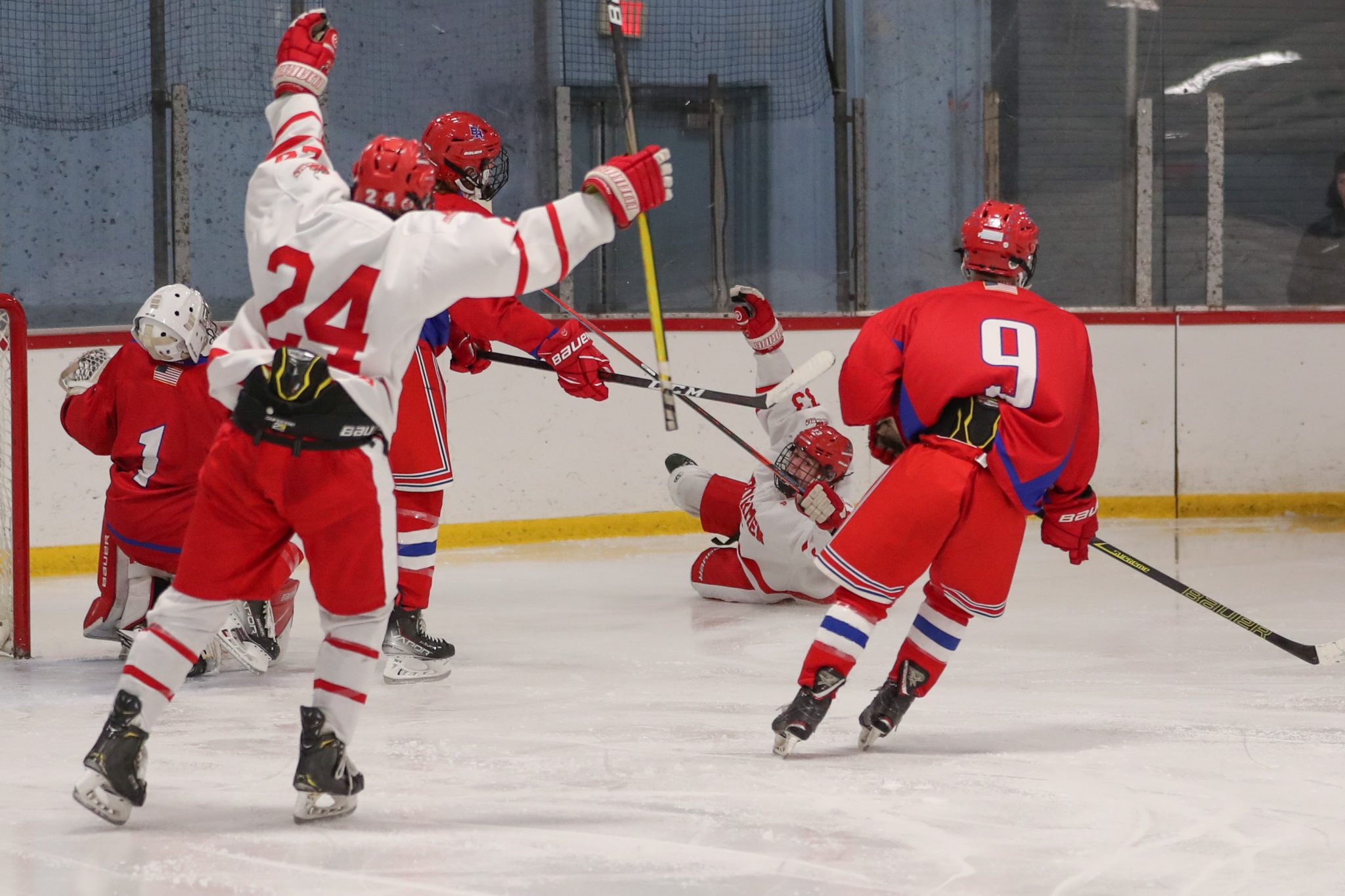 Senior Alex Barzowskas scores from his knees and slides into the boards to give Hingham the 2-0 lead in the third. 