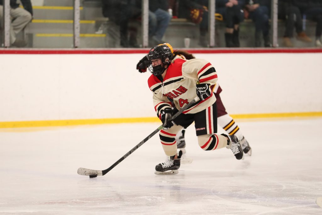 Junior Erin Packard breaks away down the ice before scoring a goal. 