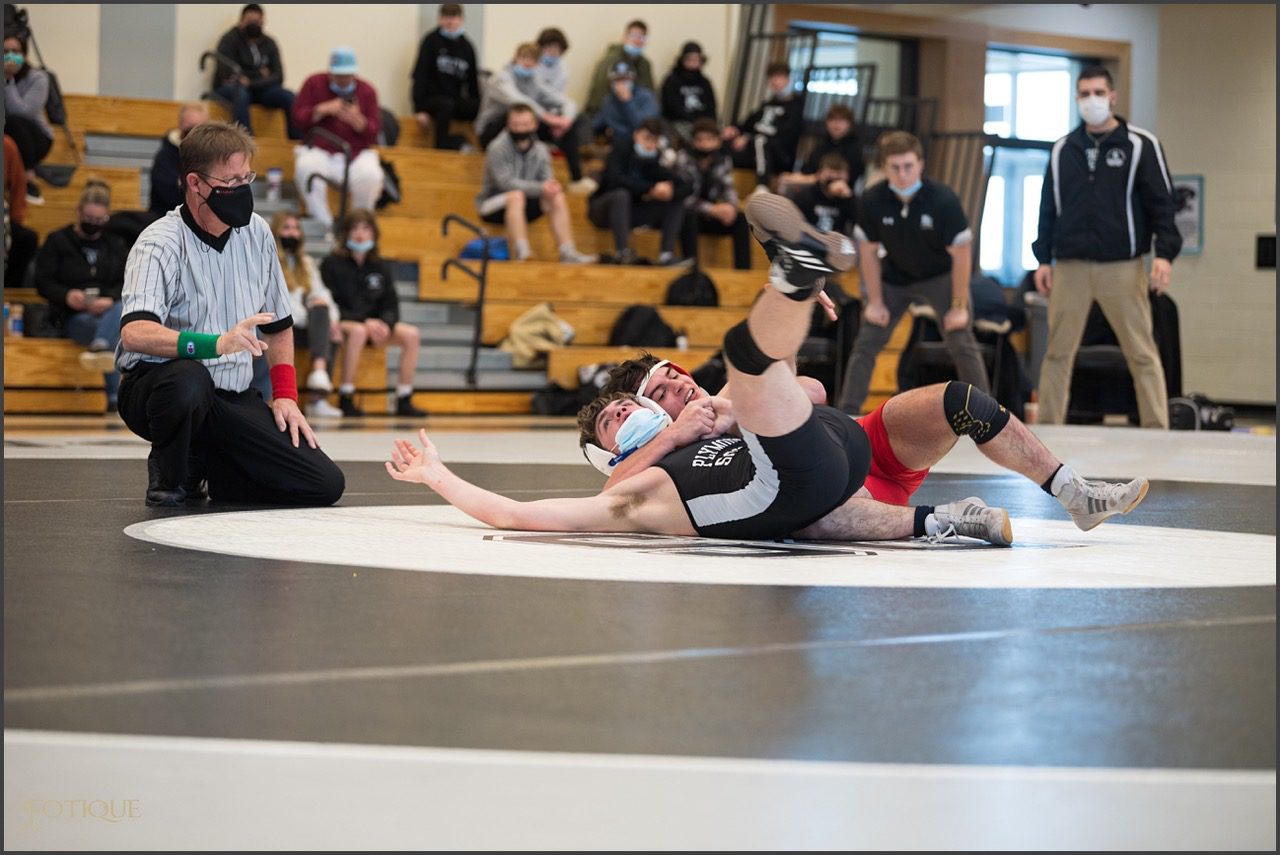 Junior Jack Kelleher wraps up his opponent from Plymouth South.