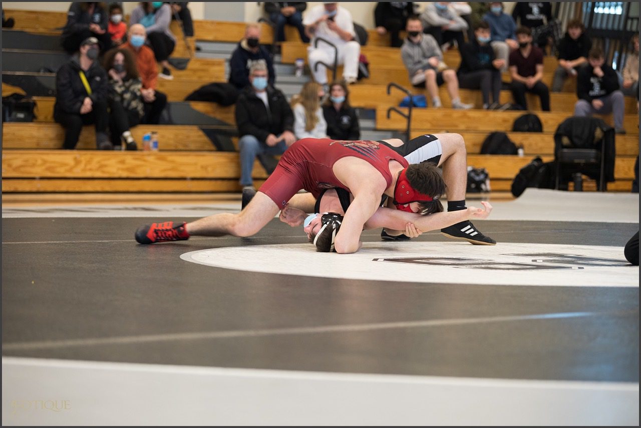 Senior Aiden Parker gets a pin in his match versus Plymouth South.