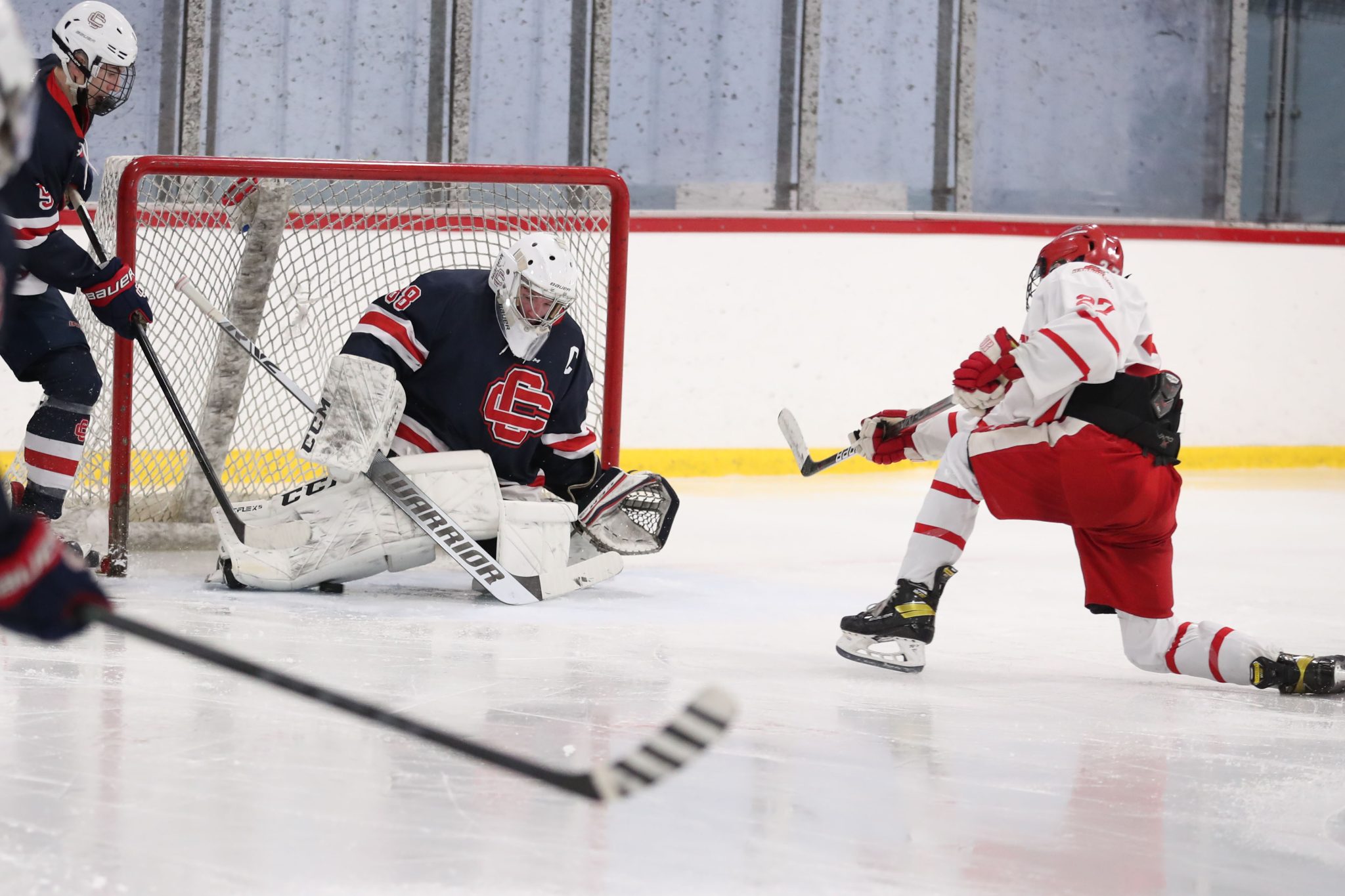 Junior Ace Concannon slips one under the pad of the Central Catholic goalie to giving Hingham the 2-1 win. 