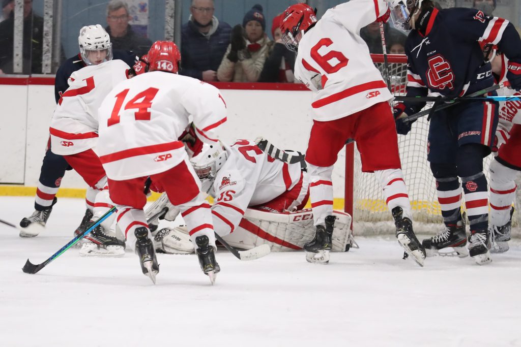 Senior Luke Merian covers up the puck in the final seconds of the game. 