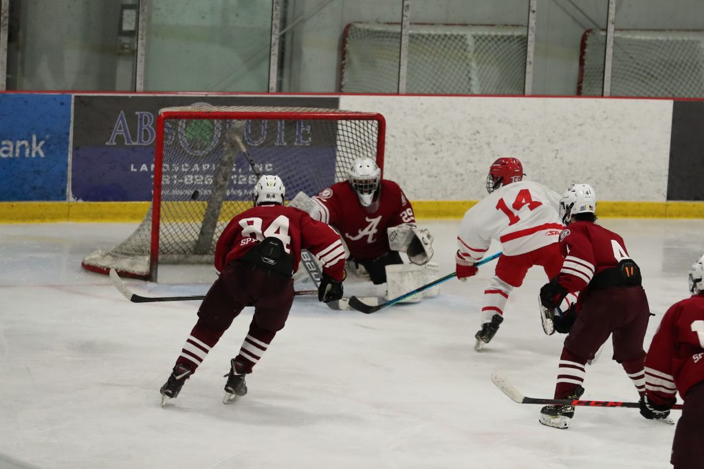 Junior Billy Jacobus beats the goalie stick side to extend Hingham's lead.