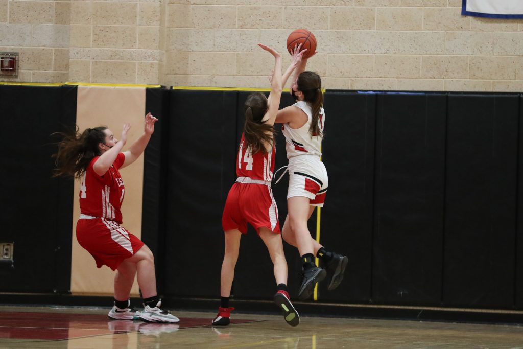 Sophomore Marissa Mathhews blocks a shot late in the game. 