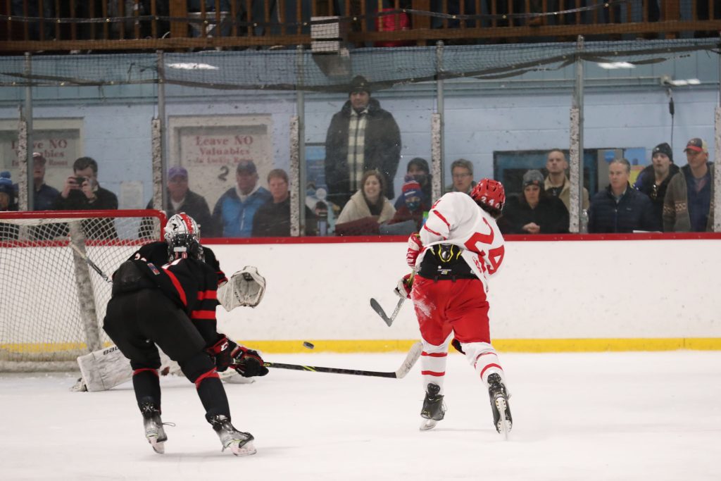 Senior John Choueiri fires a shot on a breakaway late in the second period.