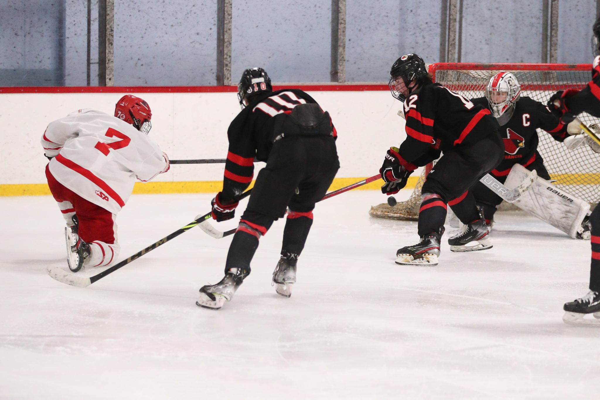 Junior Chase McKenna puts in his own rebound for the eventual game winner on Saturday.