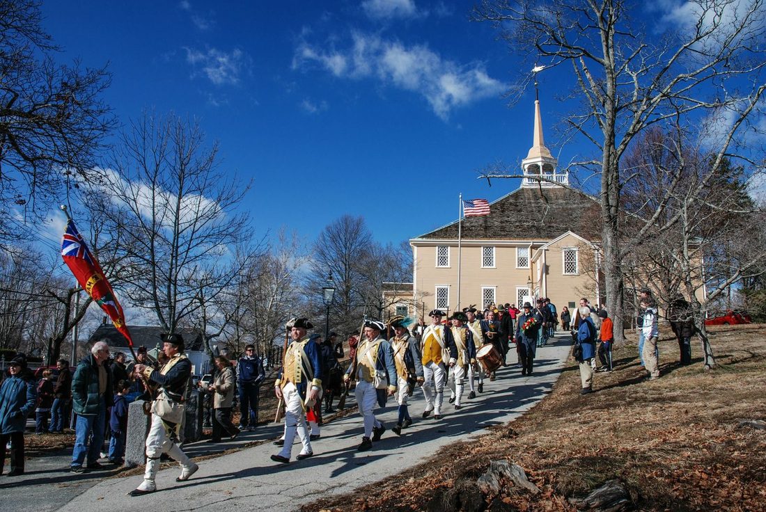 Participants of a past Lincoln Day Ceremony and the Hingham Militia Co. marching from the Old Ship Church to Fountain Square for the post ceremony wreath laying and salute. Photo Courtesy of Old Ship Church. 