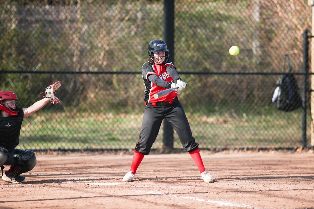 Senior Captain Amy Maffei belts a single in the third inning driving in tying run. 