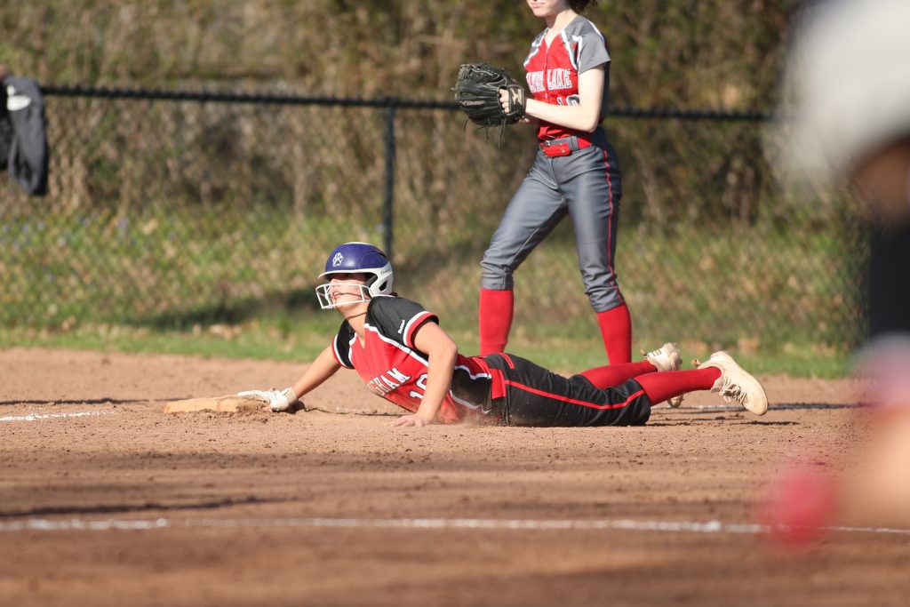 Junion Bella Sullivan is safe on third after her double in the third.