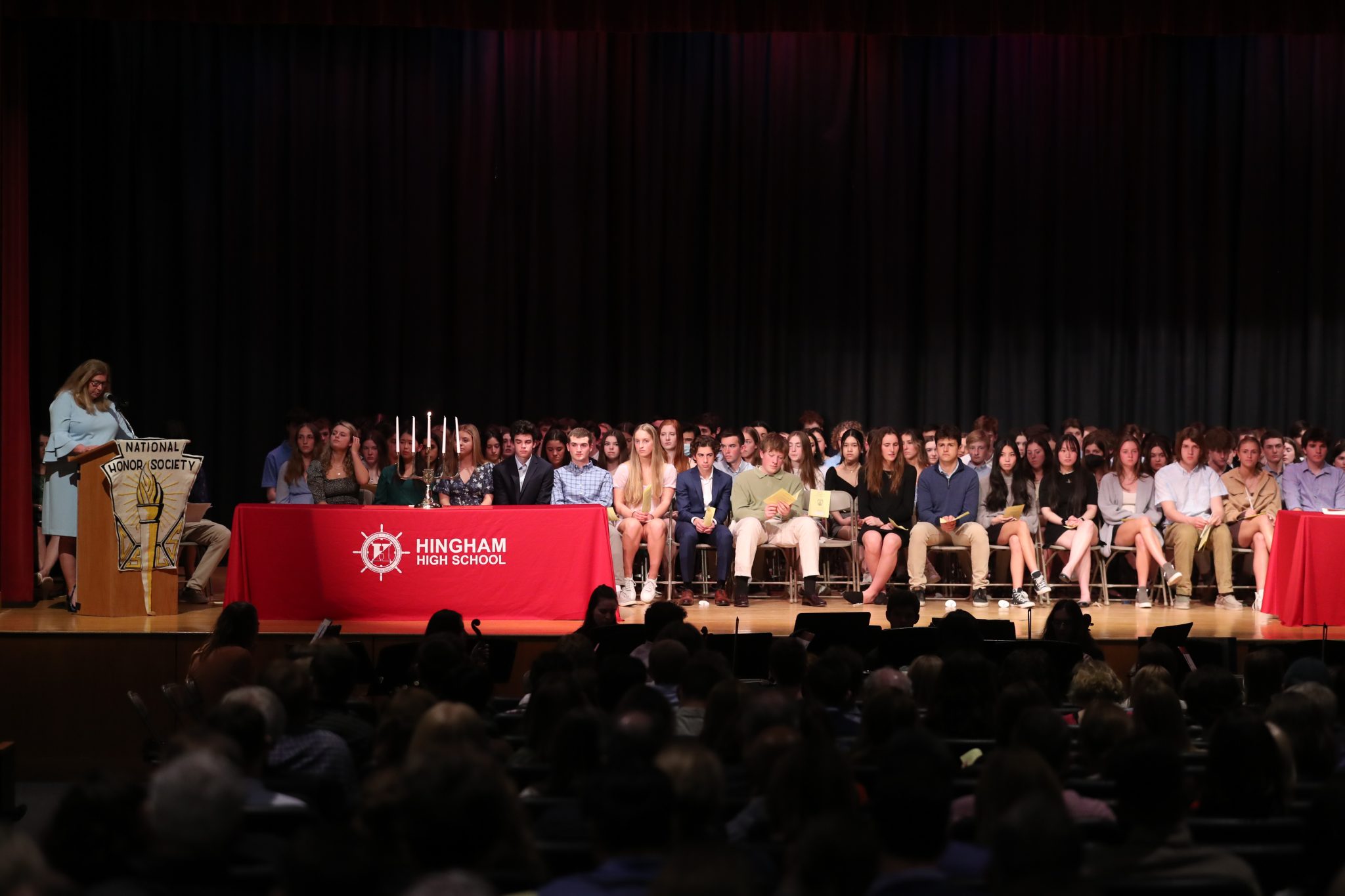 Members of the Class of 2023 sit on stage during their Induction Ceremony.