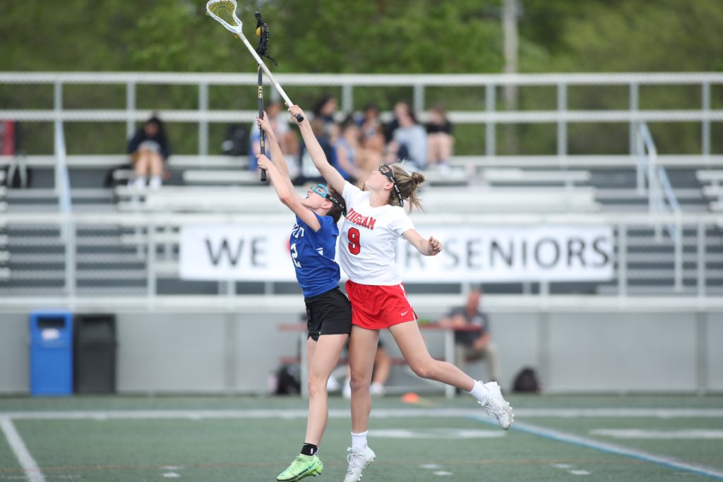 Freshman Caroline Connolly fights to win the face-off.