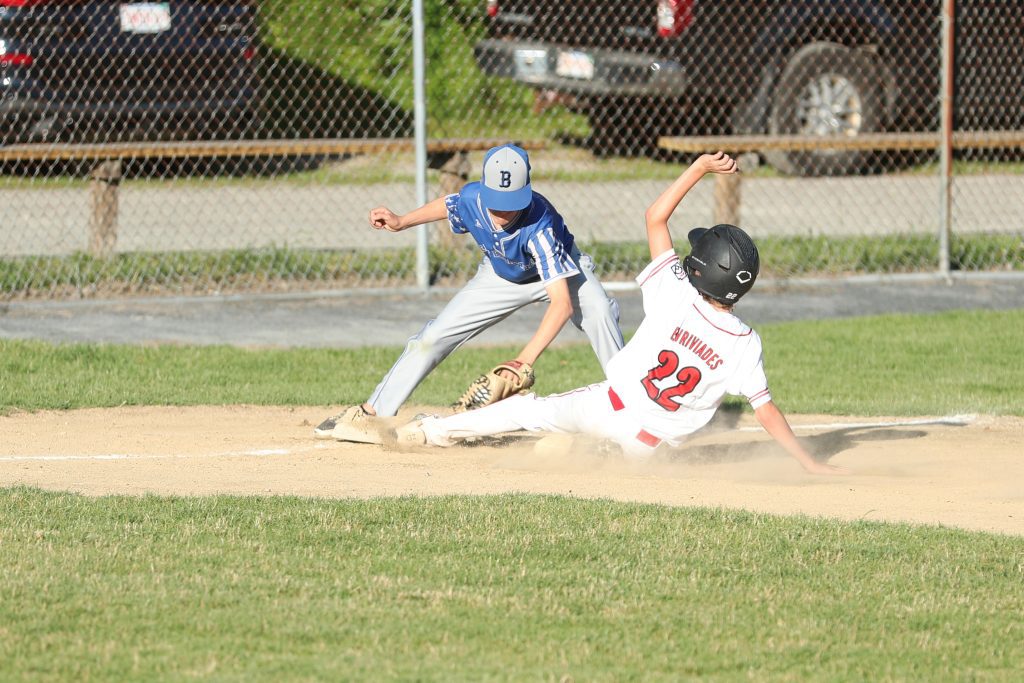 Dray Evrivaides makes it to third base in Hingham's win agasint Braintree East.