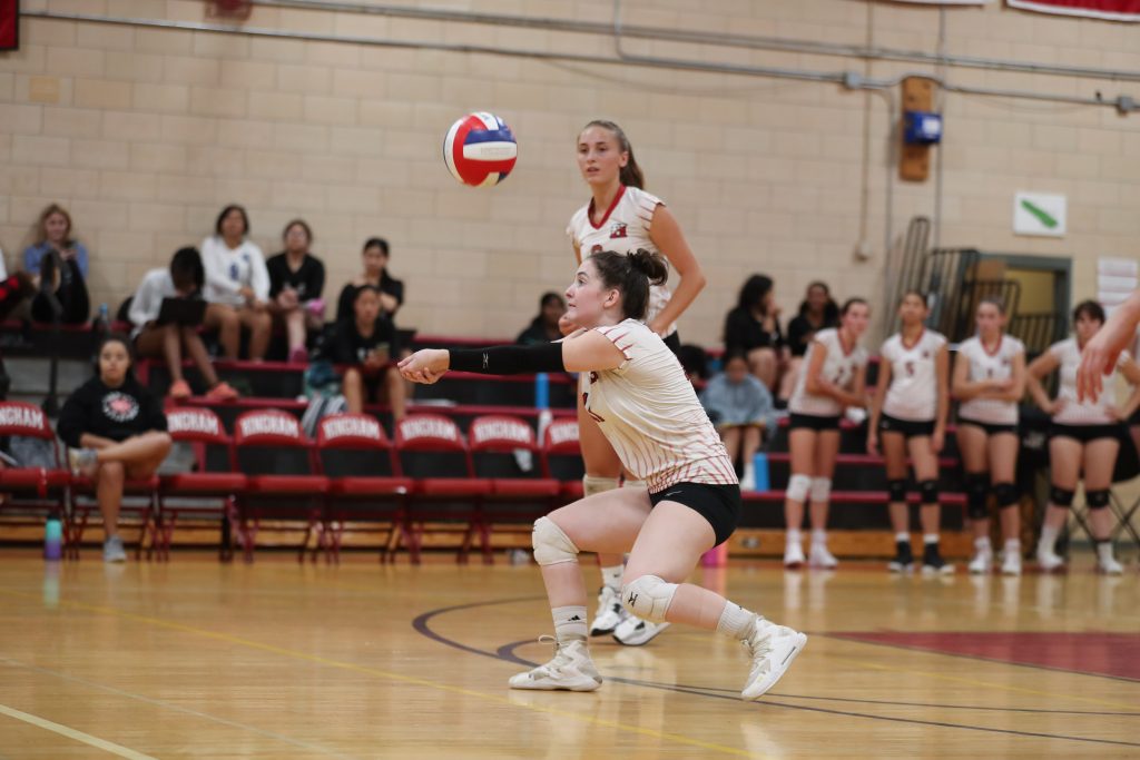 Junior Nora Andrews receives the serve early in the second game. 