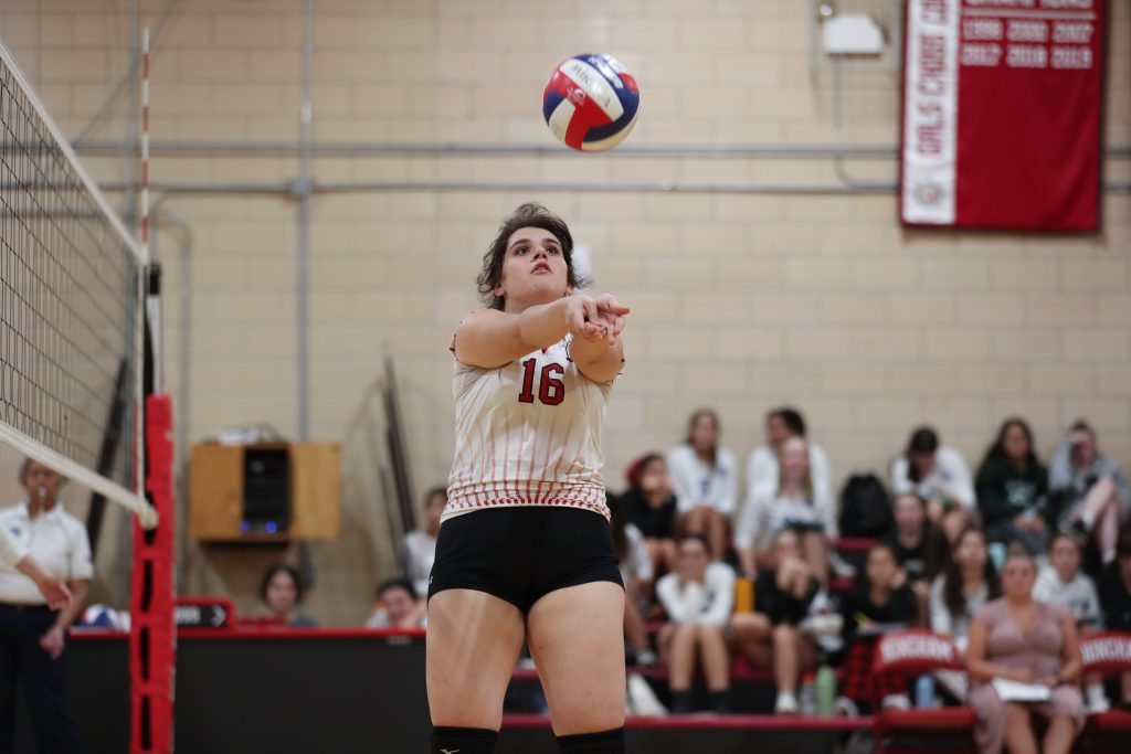 Junior Teresa Pikoulas sets her teammate in the second game. 