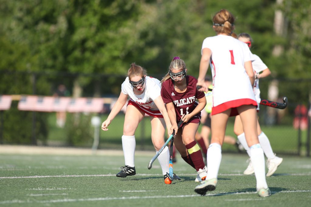 Senior Susie Anderson battles for possession against a Wildcat player. 