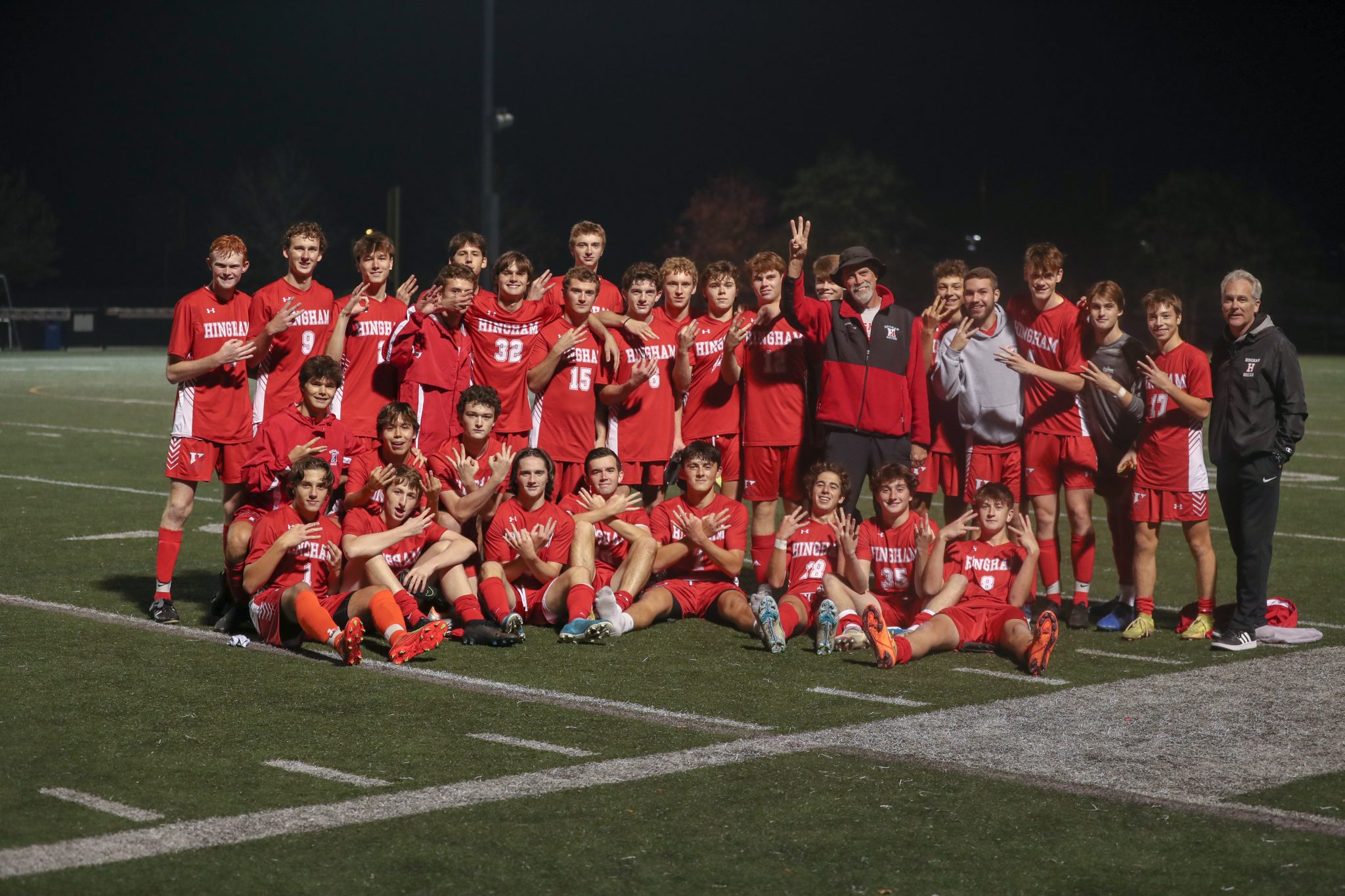 The 22/23 Boys Soccer team celebrates coach Ken Carlin's 300th win after last night's game. 