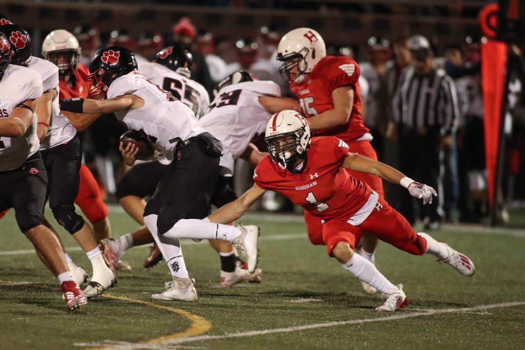 Senior captain Tony Fabrizio comes off the end and dives to trip up the QB.