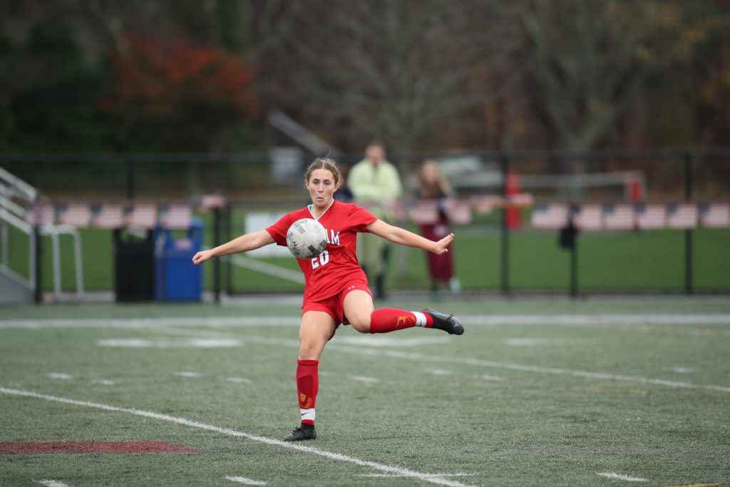 Junior Ava Varholak winds up to clear the ball. 