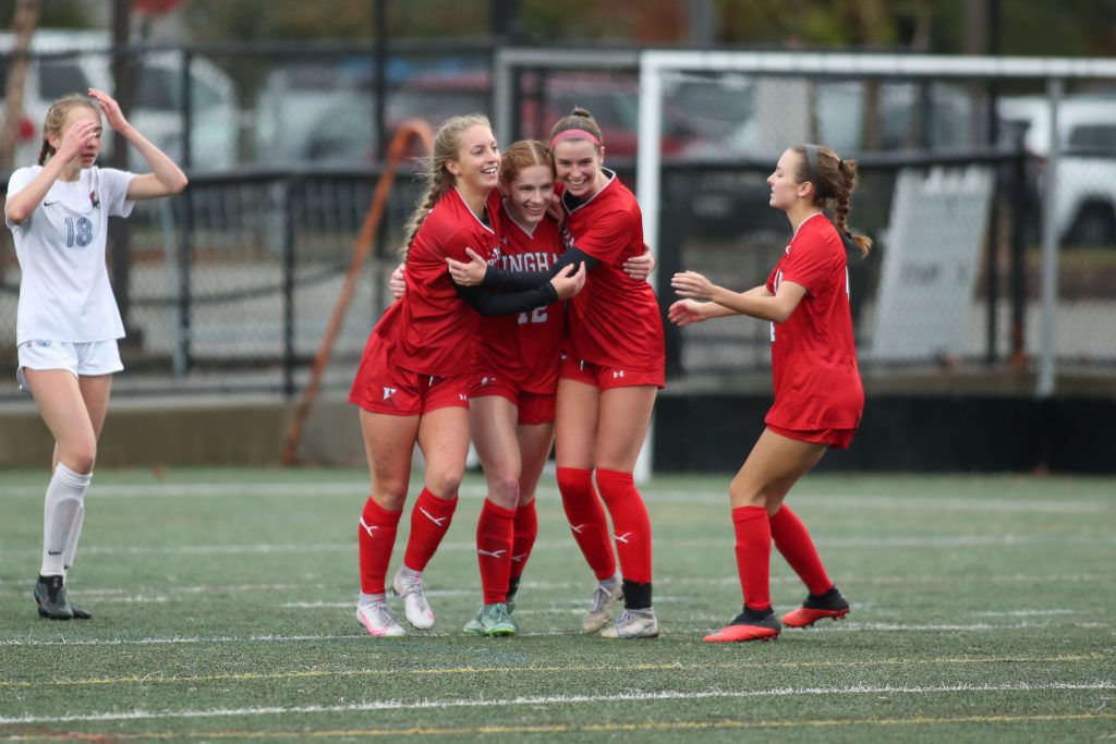 Celebrations all around after junior Claire Murray stole the ball and passed it to senior Sophie Reale for the score.