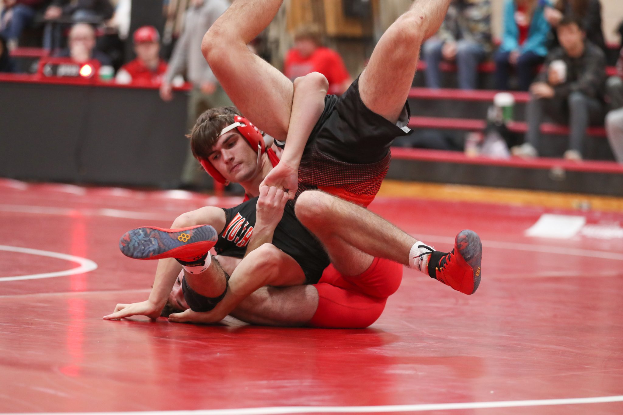Senior captain Jack Keheller pins his opponent from Stoughton in the first of three matches, and wins, on the day.