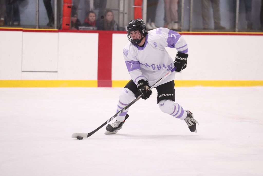 Senior captain Chase McKenna brings the puck up the ice.  
