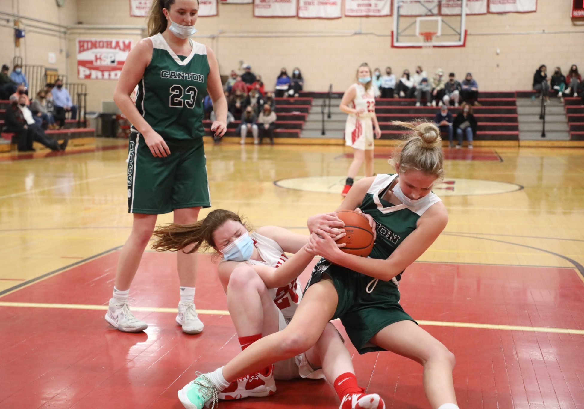 Senior Madison Aylward battles for a loose ball under the basket in Thursday night's loss to Canton.