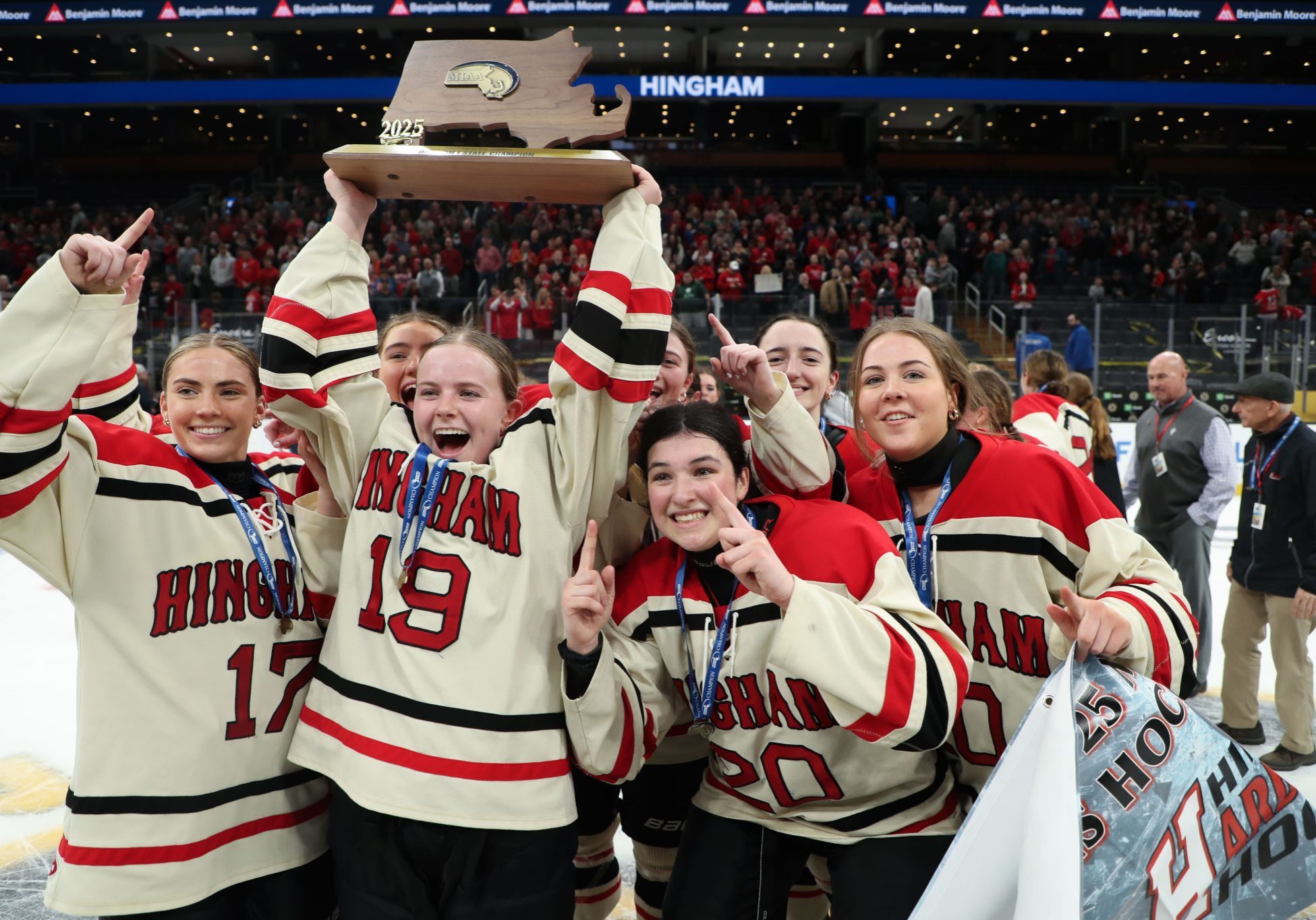 Junior captain CC Flynn holds the trophy high.