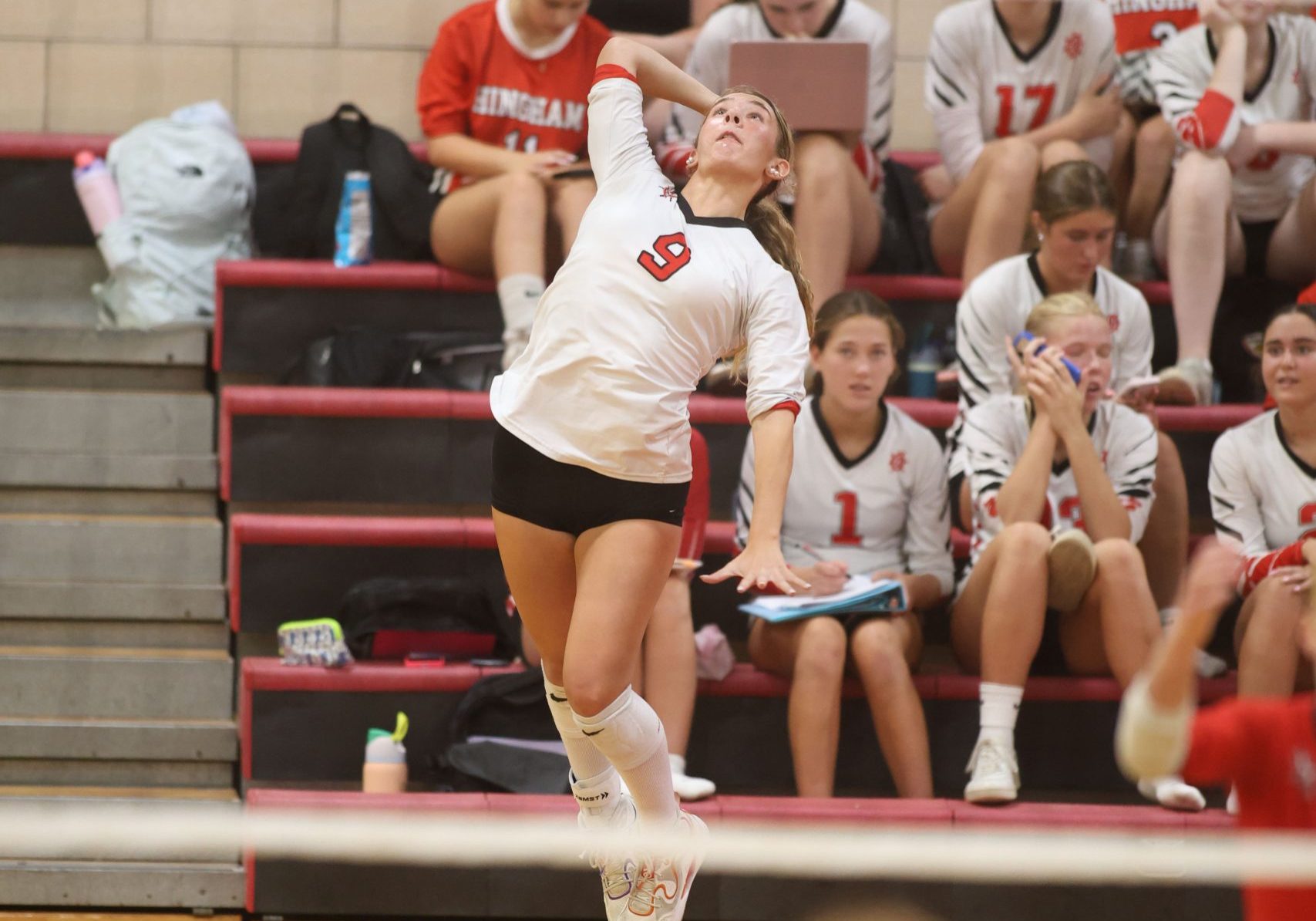 Junior Ava Boscetto serves in Hingham's match vs Pembroke earlier this season. 