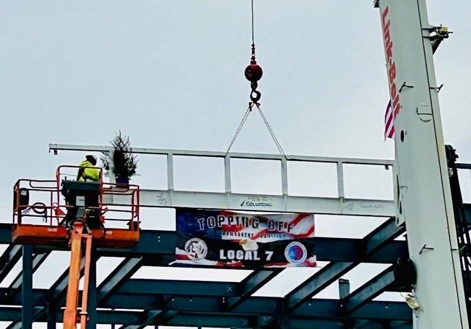 Photo: February 9, 2024, the “Topping Off” beam is hoisted in place and installed at the new Hingham Public Safety Facility on Route 3A.