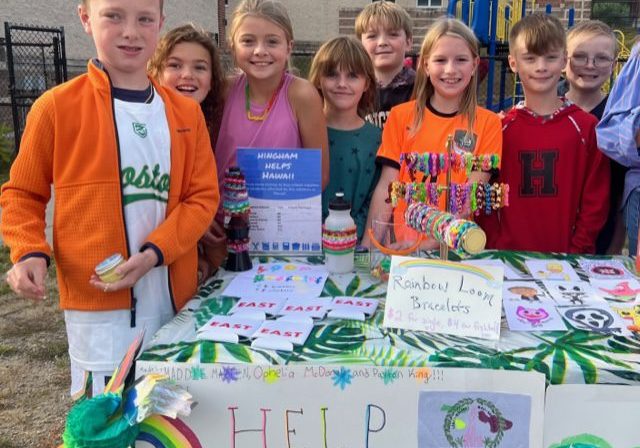 East 4th graders Charlie Estoff, Brooke Newell, Rowen Timmons, Claire Aldridge, Owen Devlin, Louisa Murphy, Matthew Calvi, and Drew Govoni sell crafts including bracelets, slime, comics, and flower bouquets and fill sign ups for services in exchange for donations at the Back to School Bash
