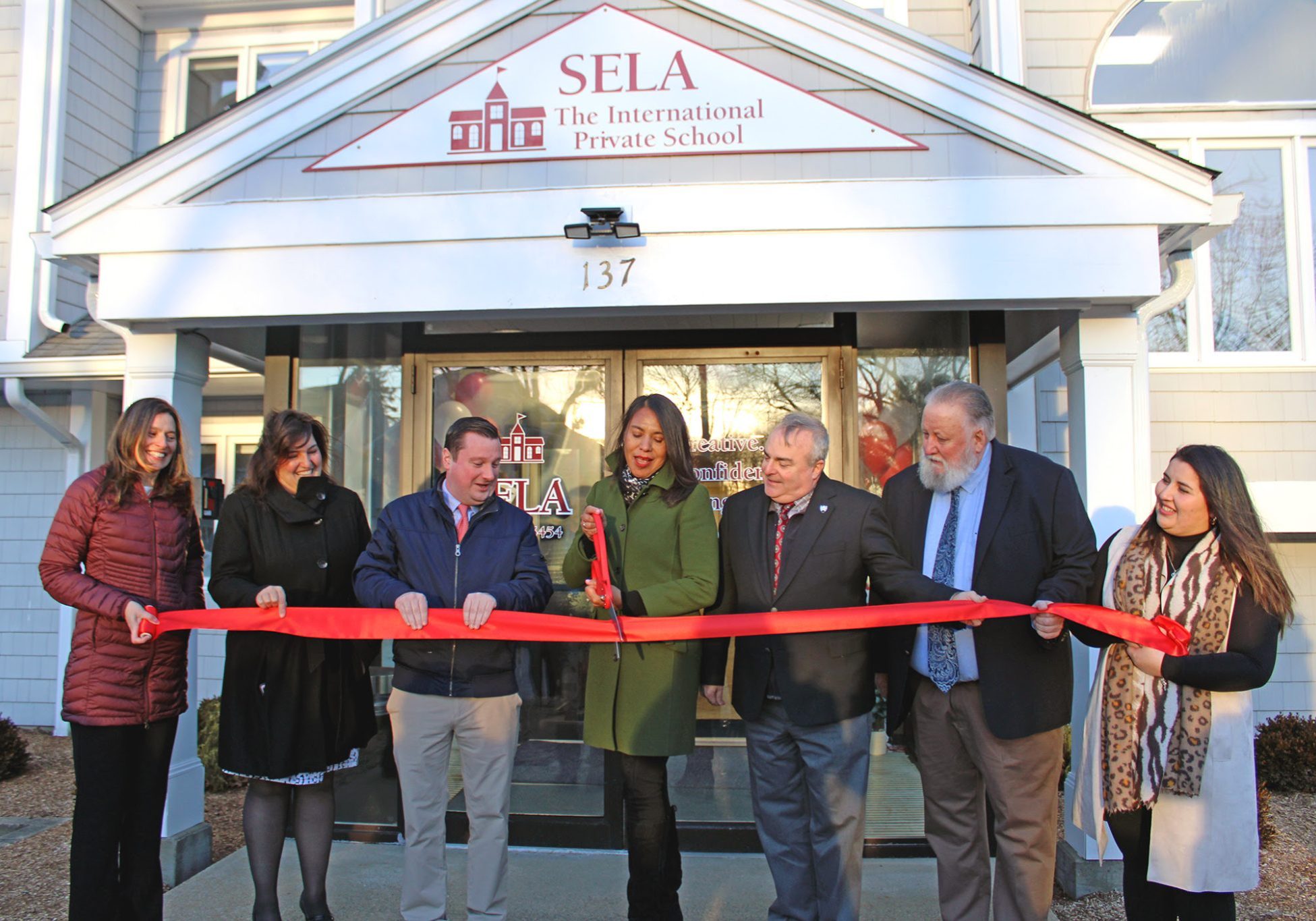 The SELA Norwell campus ribbon cutting, officiated by SELA Norwell Director of Early Global Education Stacy Dooley, Norwell Town Administrator Darleen Sullivan, State Senator Patrick O'Connor, SELA Founder Sandra Baldeon, State Representative David DeCoste, Norwell Select Board member Andy Reardon, SELA Norwell Assistant Director Eva Rios, courtesy image
